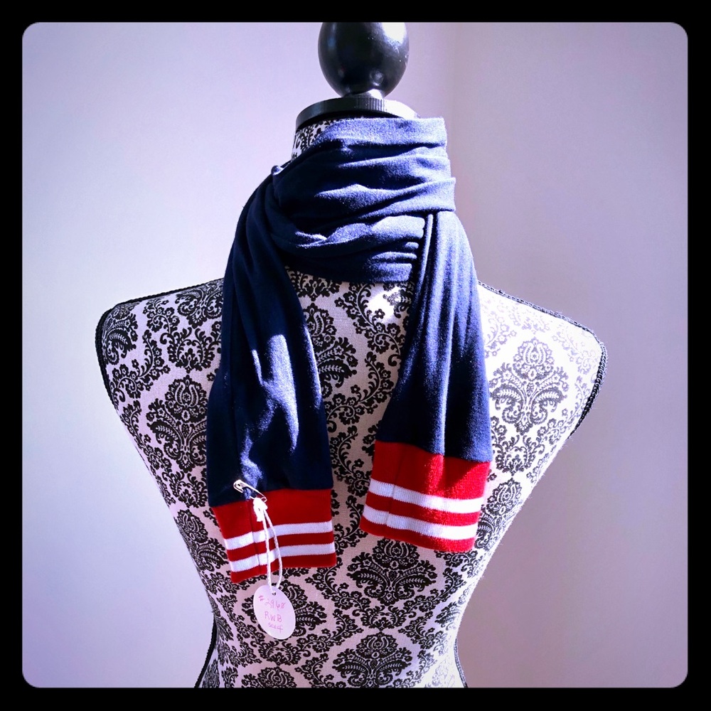 Navy blue Jersey knit sleeve style with ribbed Red/white cuff scarf or belt. 65"
